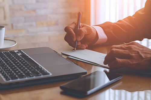 Man writing on documents